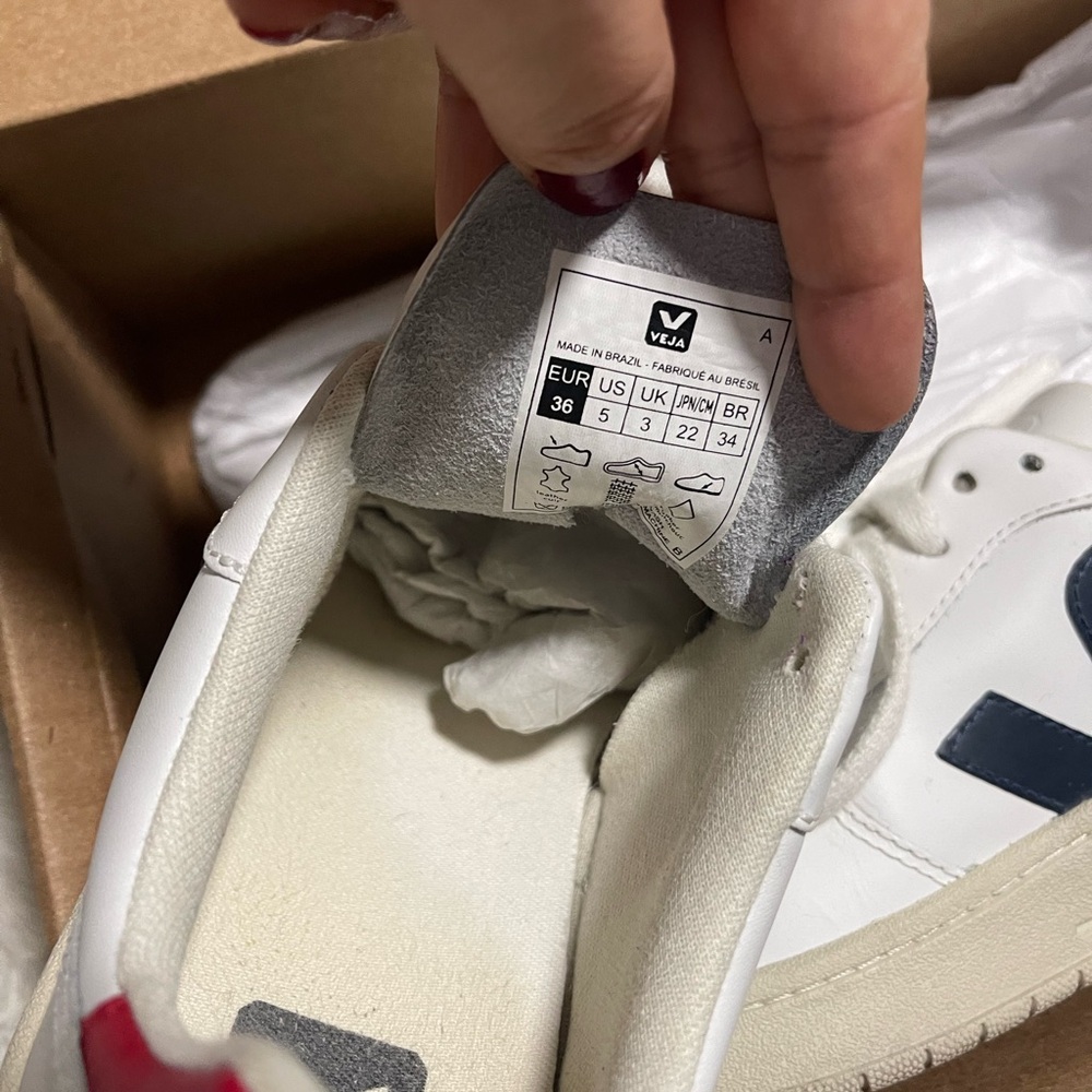 Leather veja, off white, blue,red. Looks like new and has only been used once!